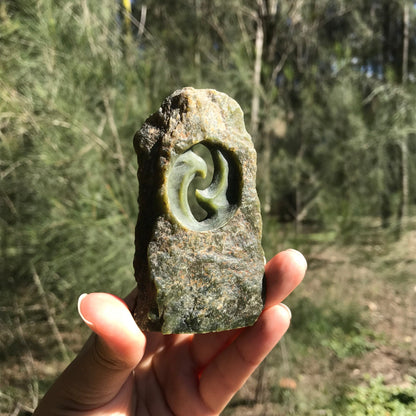 Carved paperweight (Canadian jade)