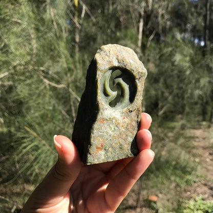 Carved paperweight (Canadian jade)